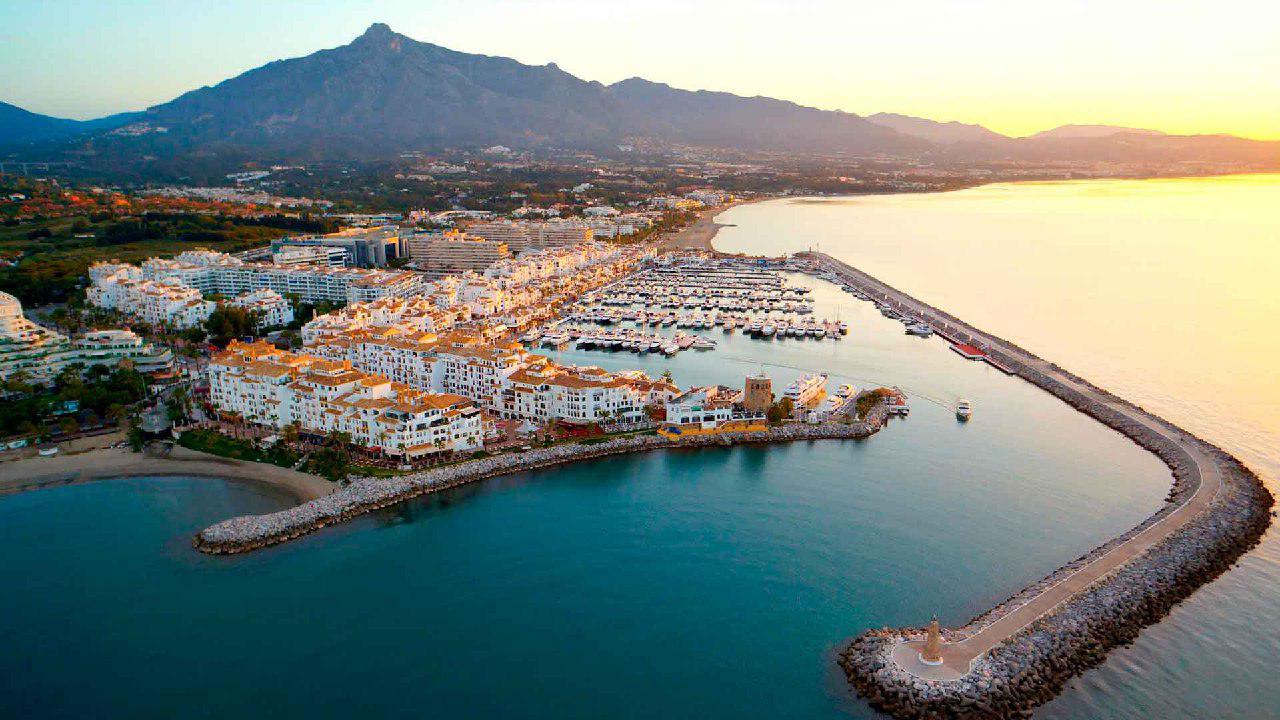 Luxury yachts and high-end shops in Puerto Banús marina.