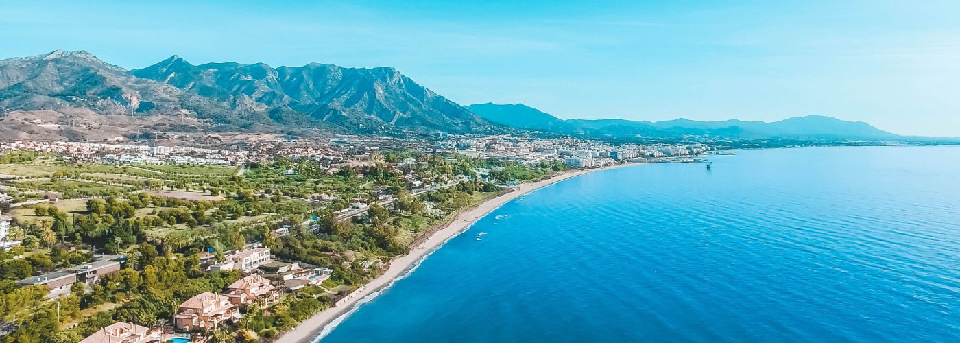 Luxury yachts docked at Puerto Banús marina.